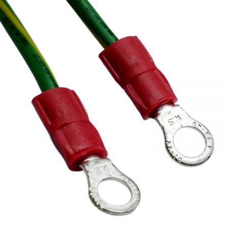Close-up of dual red insulated ring terminals on 16AWG earth wire.