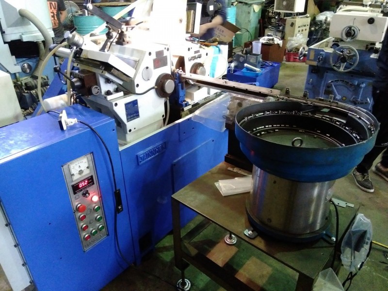 The Jainnher JHC-12BN centerless grinding machine, now part of KONFU Enterprise's production line for powder metallurgy components.