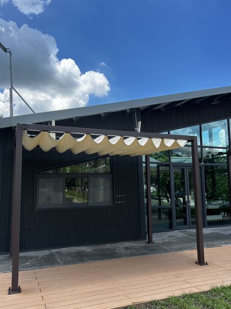 Wave-Shaped Sail Shade for Outdoor Lounge Area