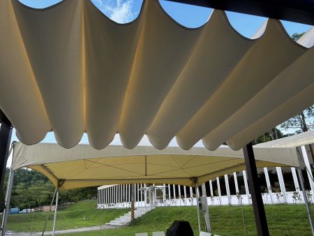 Wave-Shaped Sail Shade for Riverside Recreation