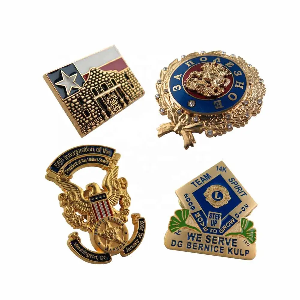 Four commemorative pins or badges, likely related to official events or organizations.