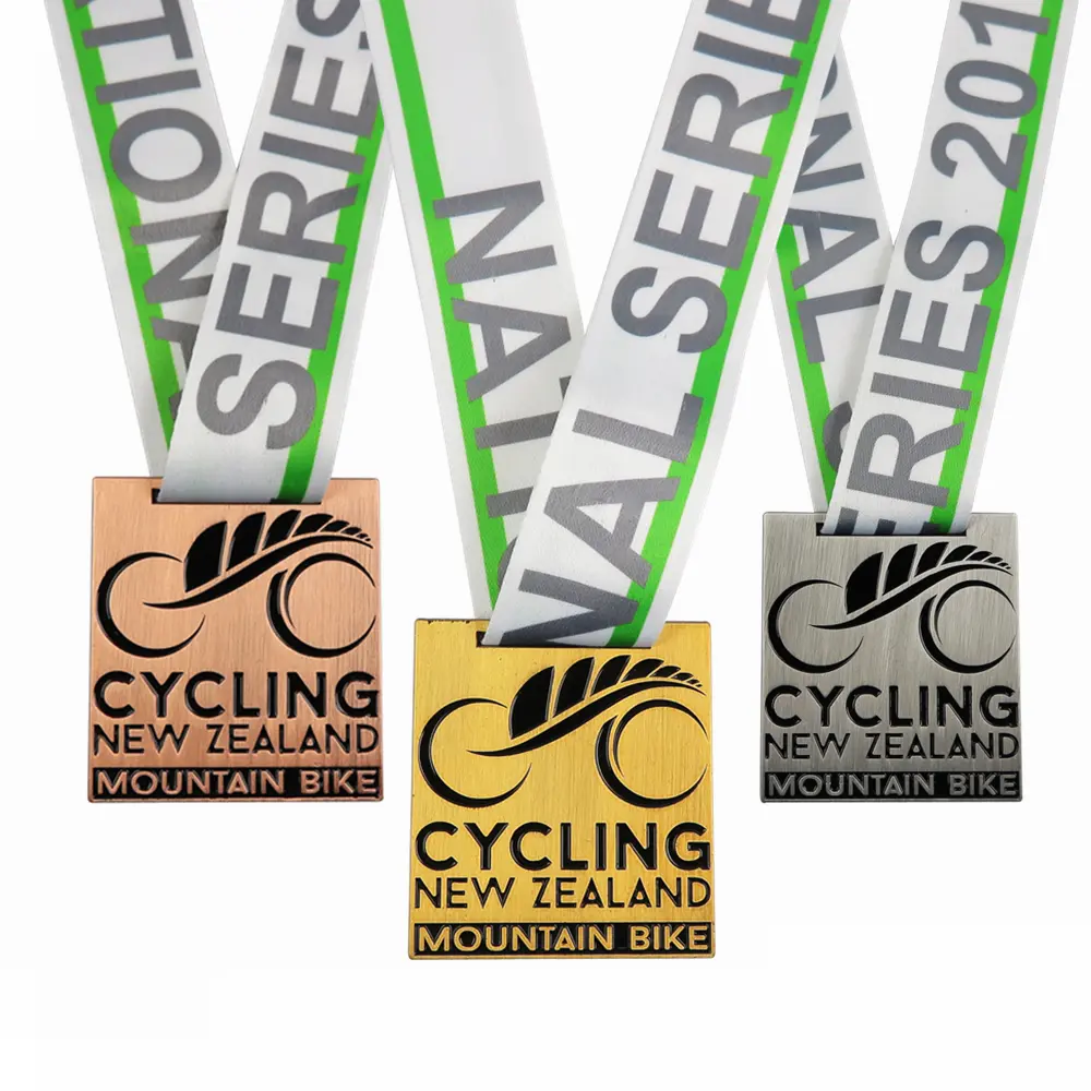 Custom medals for a mountain bike series in New Zealand, showcasing different designs and rankings.