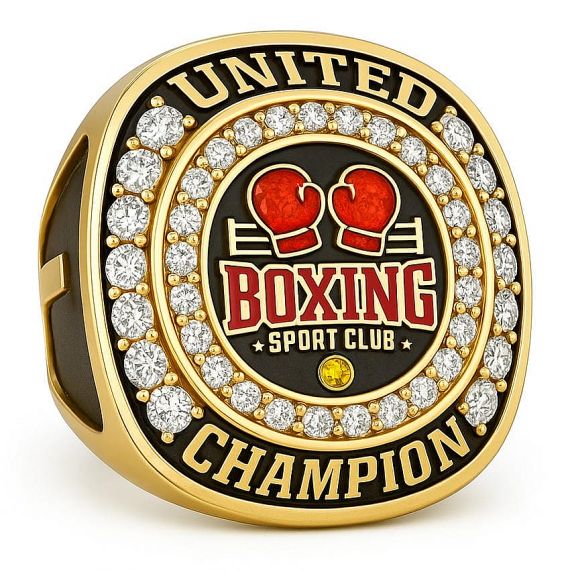 Gold Military Academy class ring with a large oval blue gemstone and blue enamel accents