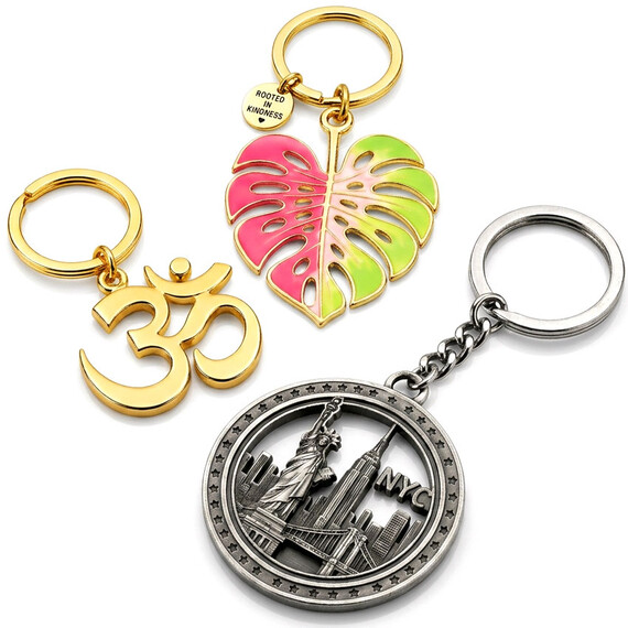 Zinc Alloy Hollow Out Keychains - Custom hollow out metal keychains featuring Om symbol, monstera leaf and New York souvenir designs