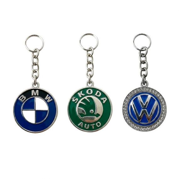 High-quality automotive brand keychains for Mercedes, Tesla, and Lamborghini in various metal finishes and designs