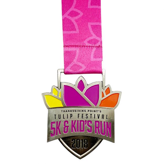 souvenir Tulip festival 5K kids run medal with pink ribbon