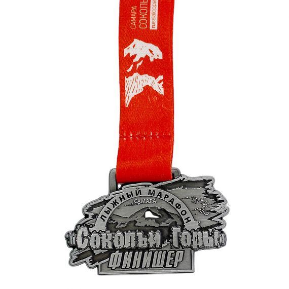Custom mountain marathon finisher medal with engraved metal and red ribbon