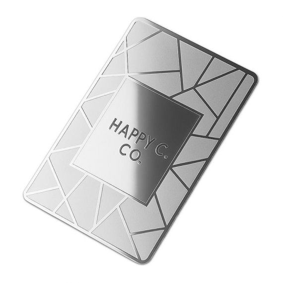 Bespoke silver metal membership card featuring laser-etched triangular patterns and a high-gloss polished center for creative design agencies.