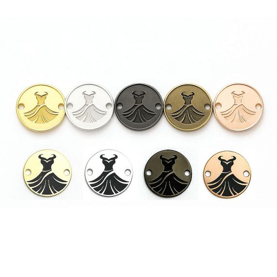 Circular metal charms featuring a dress silhouette logo in etched and printed styles; luxury sew-on labels for evening wear and bridal boutiques.