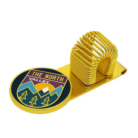 Custom gold-plated metal spring pen holder with "The North Valley" soft enamel logo, personalized magnetic notebook pen clip for office stationery.