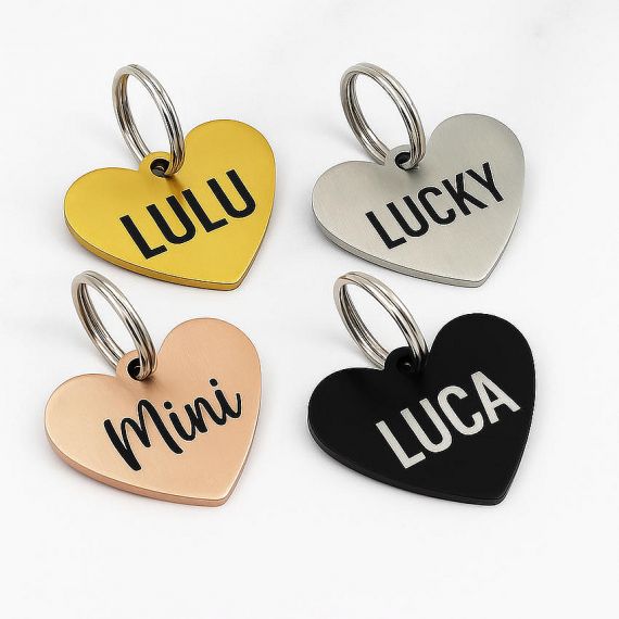 Personalized heart shaped metal pet ID tags for cats and dogs feature durable deep-etched black lettering for long-lasting readability.
