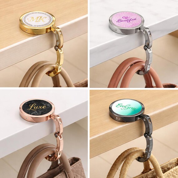 Foldable Purse Hooks for Table - Portable foldable purse hooks for table with custom brand logo, featuring round metallic handbag hangers in gold, silver, rose gold, and gunmetal finishes.