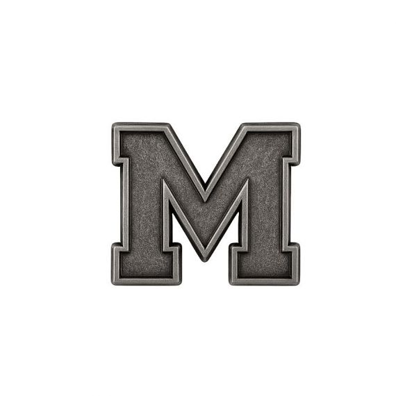 Detailed antique silver monogram pin with a professional cut-out design