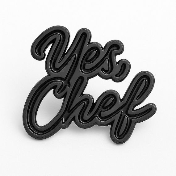 Minimalist matte black cut-out pins featuring "Yes Chef" typography.