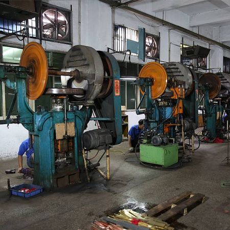 Metal Factory - An overview of the Jin Jumbo metal factory workshop, showcasing machinery and skilled workers during the manufacturing process.