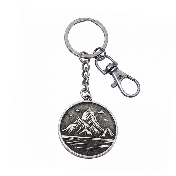 Antique silver-plated keychain with a stamped mountain lake design and no color fill