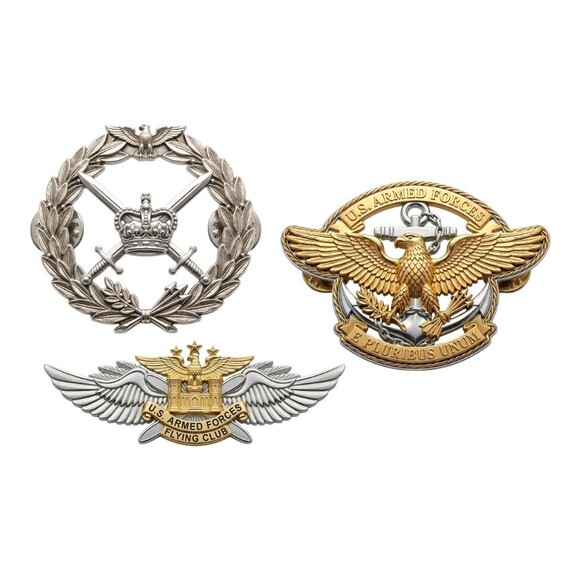 Military Cap Badges - Assorted military cap badges with eagle and wings