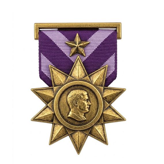 Antique gold star military medal with profile