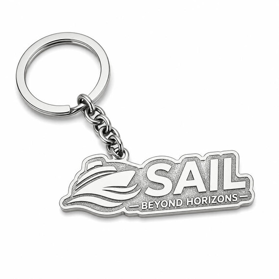 Custom zinc alloy logo keychain with polished nickel borders and textured recessed metal background without enamel