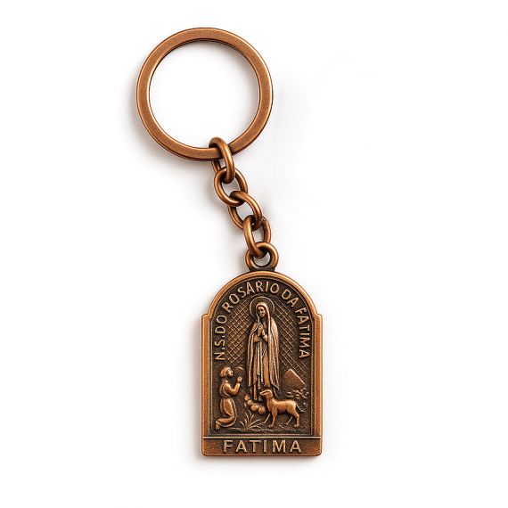 Vintage-style metal keychain with "N.S. DO ROSARIO DA FATIMA" inscription and a detailed religious scene in antique copper