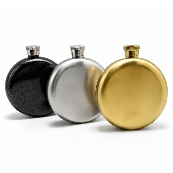 Stainless Steel Round Hip Flasks - Custom 5oz round stainless steel hip flask set in glitter black, brushed silver, and matte gold finishes, premium personalized portable liquor flask for gifts.