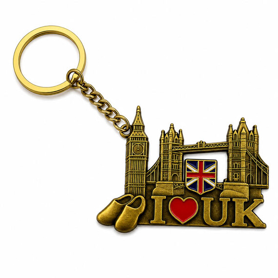 Antique gold UK souvenir keychain with detailed landmark design.