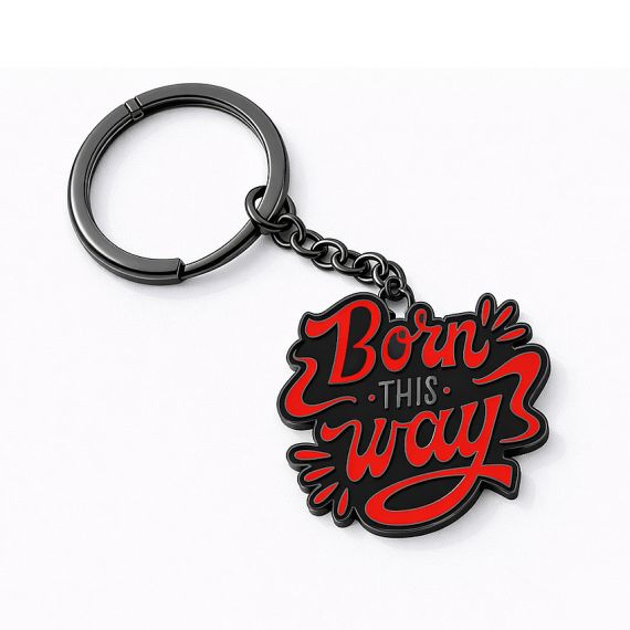 Black-plated zinc alloy slogan keychain with vibrant red enamel lettering saying "Born This Way".