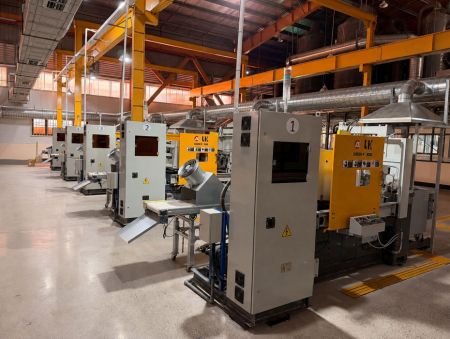 Metal Factory - An overview of the Jin Jumbo metal factory workshop, showcasing machinery and skilled workers during the manufacturing process.