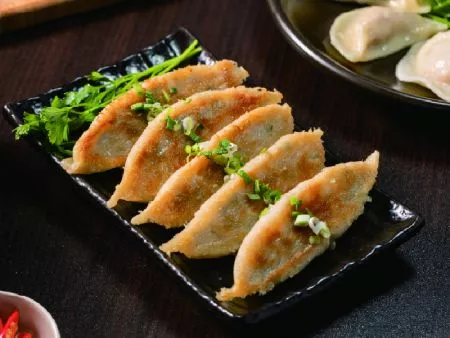 Potstickers made with highly efficient automated production