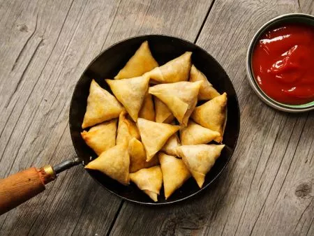 The thin Samosa Pastries are crispy after deep frying