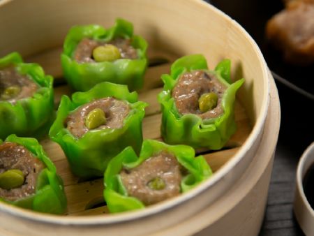 Shumai is automatically garnished with peas