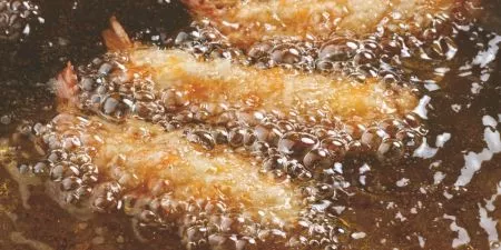 Food products completely emersed in frying oil