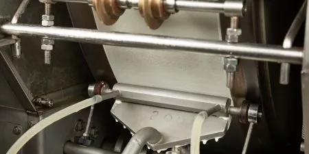 Batter is spread on a heated pastry baking drum