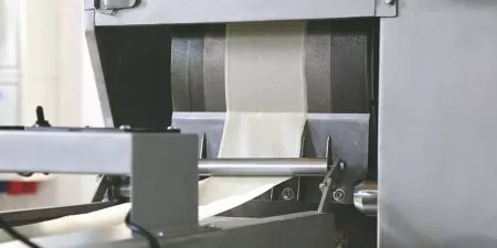 The pastry sheet cools on a 1.3-meter cooling conveyor