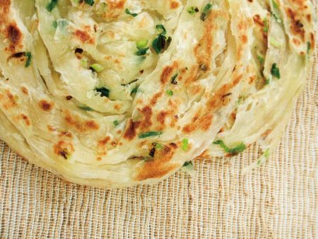 Scallions evenly rolled into the pancake
