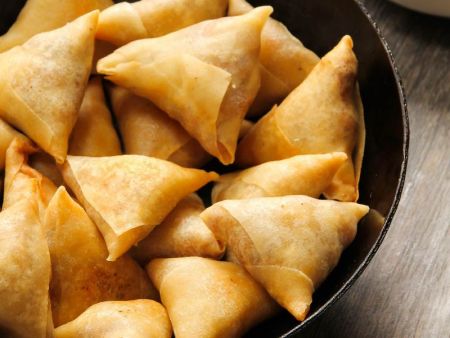 Samosas are folded by hand