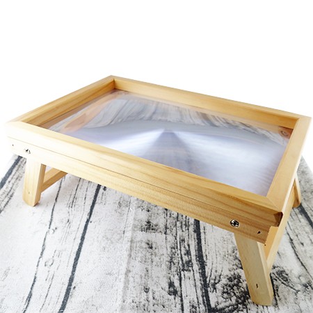 Wooden magnifying glass on Stand