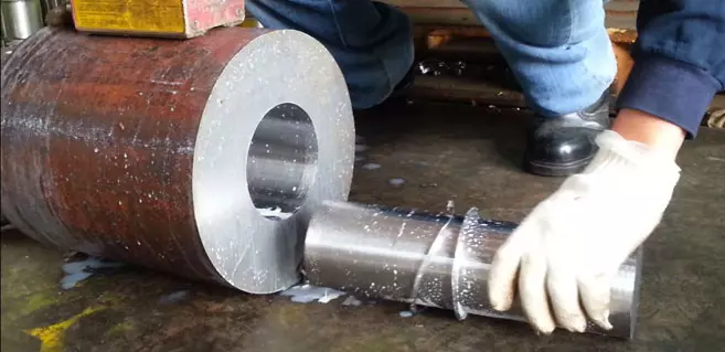 Ju Feng provides steel-drilling services for customers.