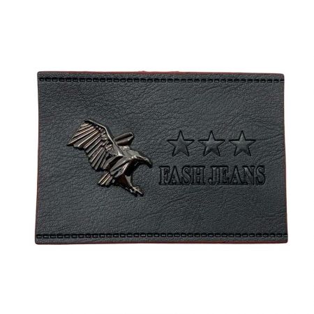 real leather label with an metal rivet in eagle design