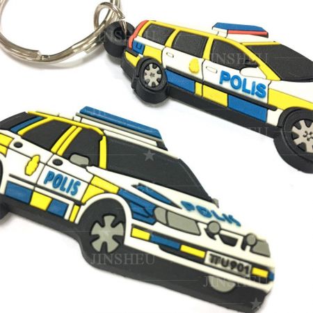 indywidualnie wykonany brelok do kluczy w kształcie policyjnego samochodu z gumy