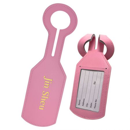 Pink leather luggage labels with gold foil stamped corporate logo