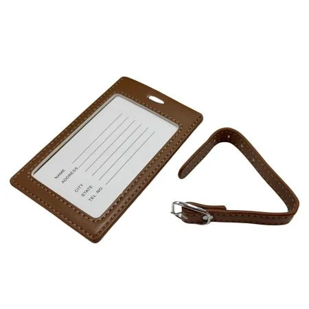 The back side of leather luggage tag with information card and an leather strap