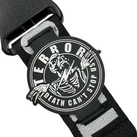 closeup view of the PVC piece on woven lanyard