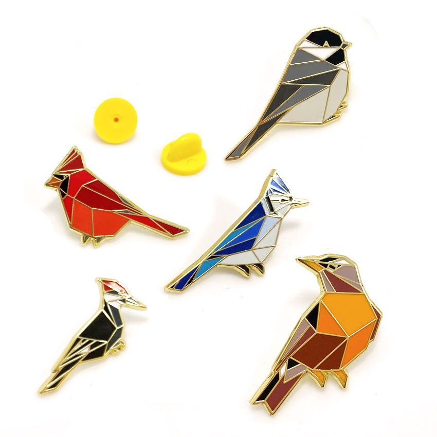 Bird badges made with imitation hard enamels.