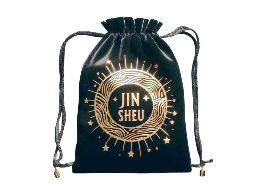 Black velvet pouch adorned with foil stamping in gold