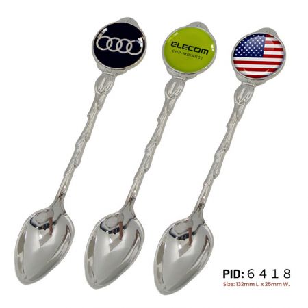 Personalised souvenir spoons with custom epoxy stickers