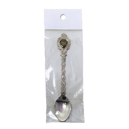 commemorative spoon in a clear self-adhesive retail bag