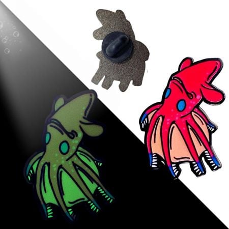 custom pin badges featuring vampire squid and glow in the dark