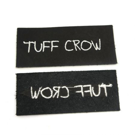 Nhãn logo thêu da thật - Nhãn logo thêu da thật