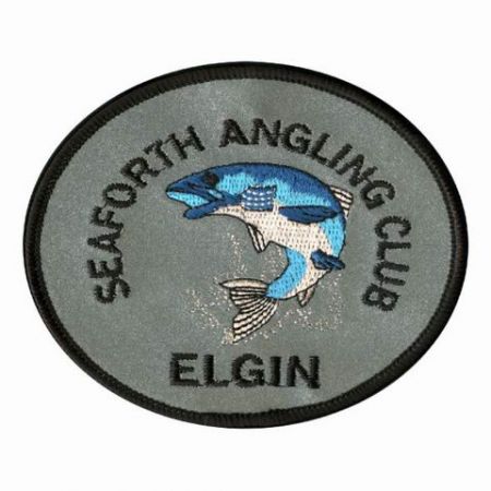 Heijastava tikkauksella varustettu merkki - Heijastava kirjontatikkausmerkki